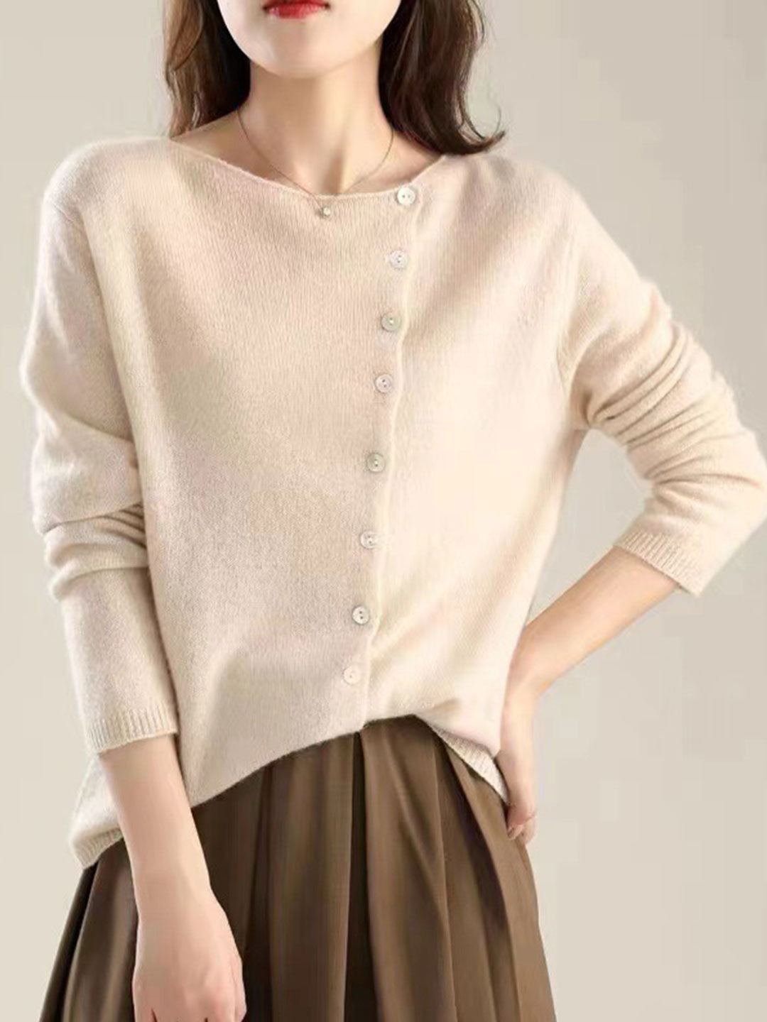 Women's V-neck button-front long sleeve cardigan with softly shaped collar and hip-length hem