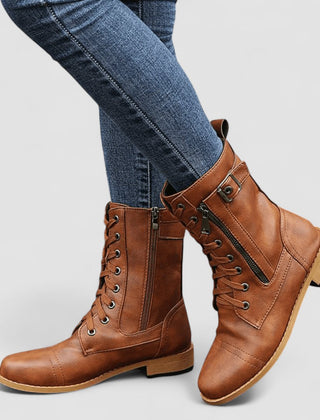 Buckled mid-calf combat boots with lace-up front and low block heel in brown, black and grey