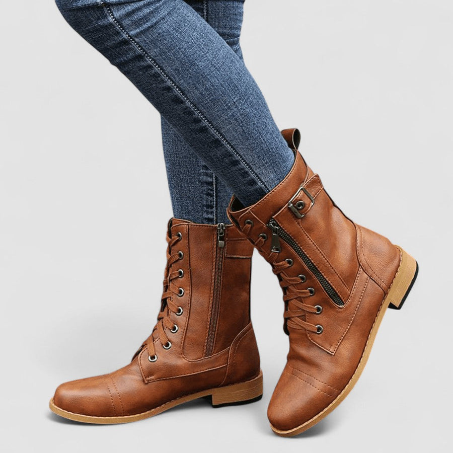 Buckled mid-calf combat boots with lace-up front and low block heel in brown, black and grey