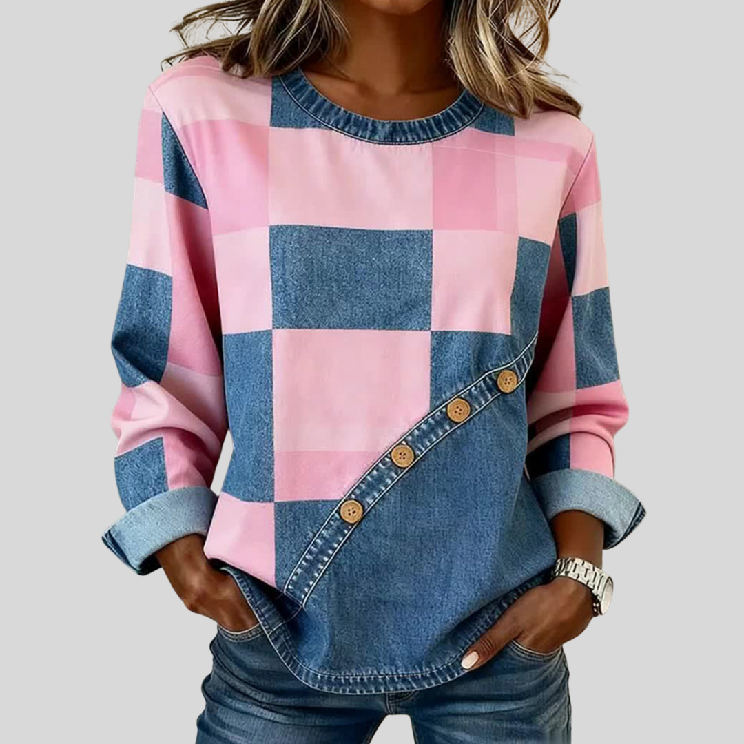 Pink and denim-toned patchwork sweatshirt with diagonal wooden buttons and ribbed trim