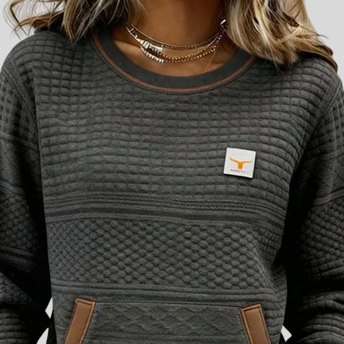 Women's crew neck colorblock sweatshirt with quilted texture panels and front kangaroo pocket