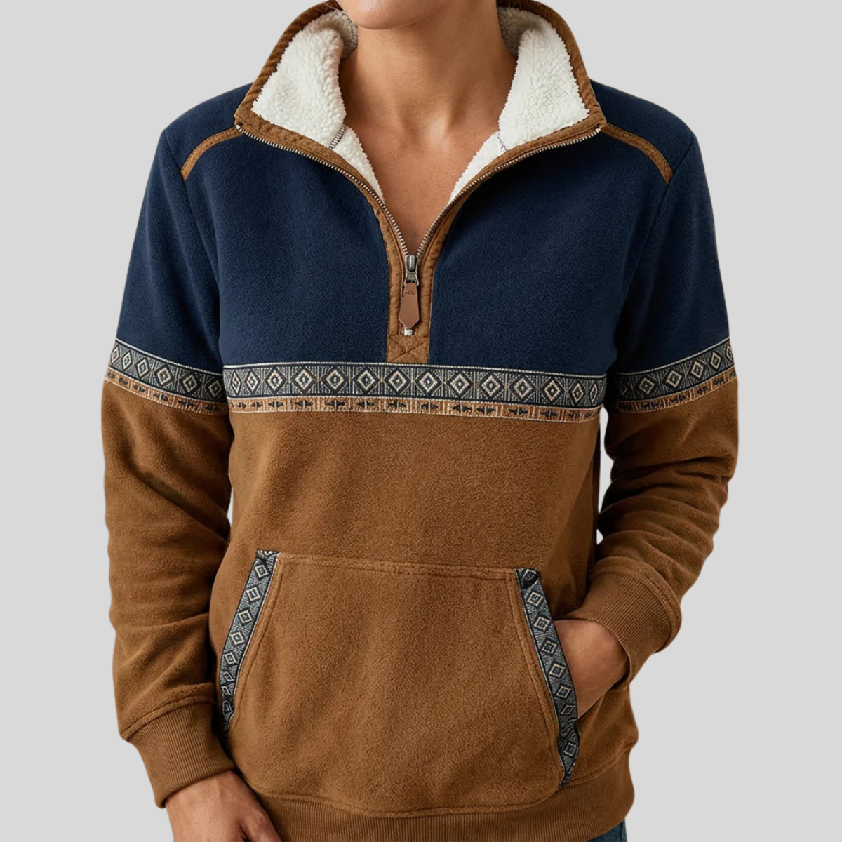 Navy and caramel color-block half-zip pullover with sherpa collar and geometric chest trim