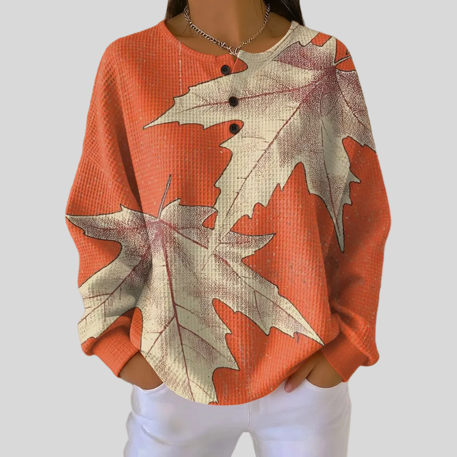 Relaxed-fit waffle-knit sweatshirt with cream and orange autumn leaf print and button neckline