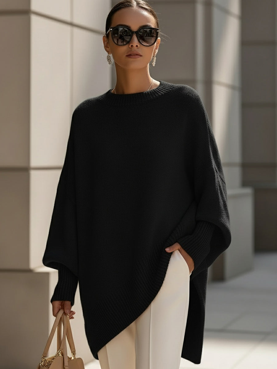 Oversized poncho-style sweater with round neckline, ribbed cuffs and hem in a neutral tone
