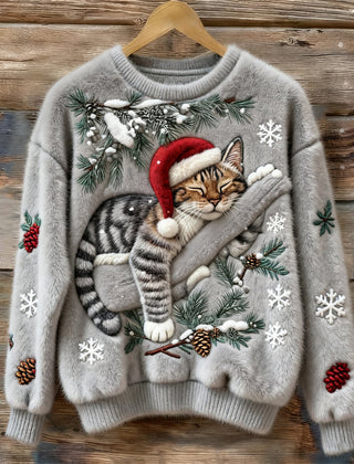Women's crew neck sweater with a festive cat graphic and winter motifs, long sleeves and ribbed cuffs