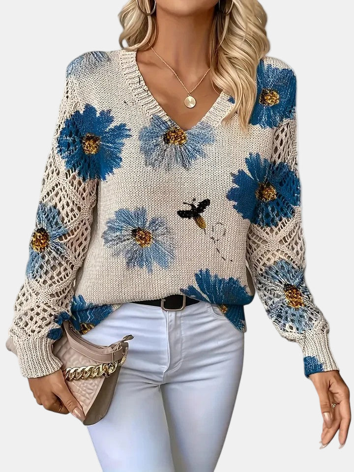 Women's floral knit V-neck sweater with open-knit sleeves and ribbed cuffs and hem