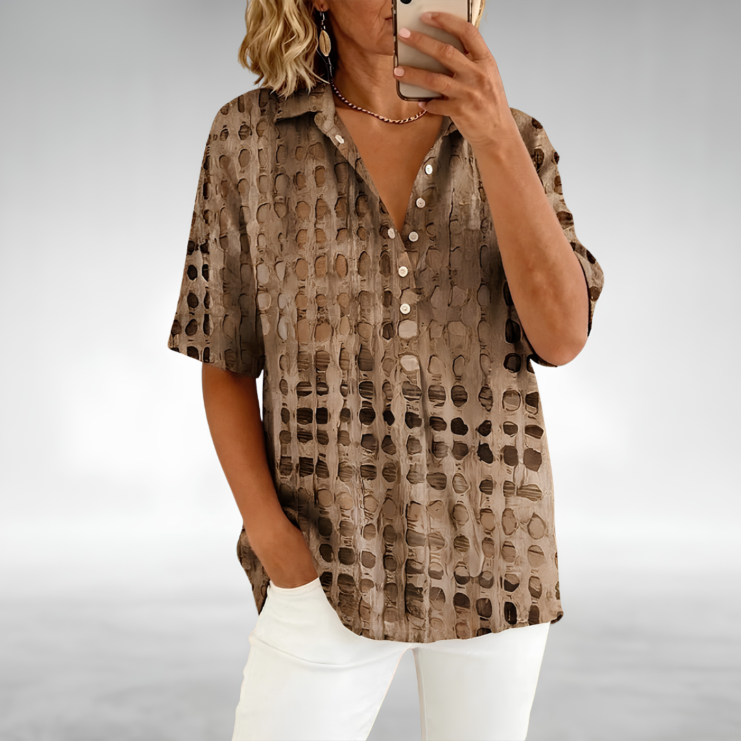 Woman wearing an elegant relaxed lightweight blouse with a soft, flowing drape