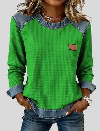 Waffle-knit sweatshirt with denim-inspired trim and a small chest patch, shown in several colours