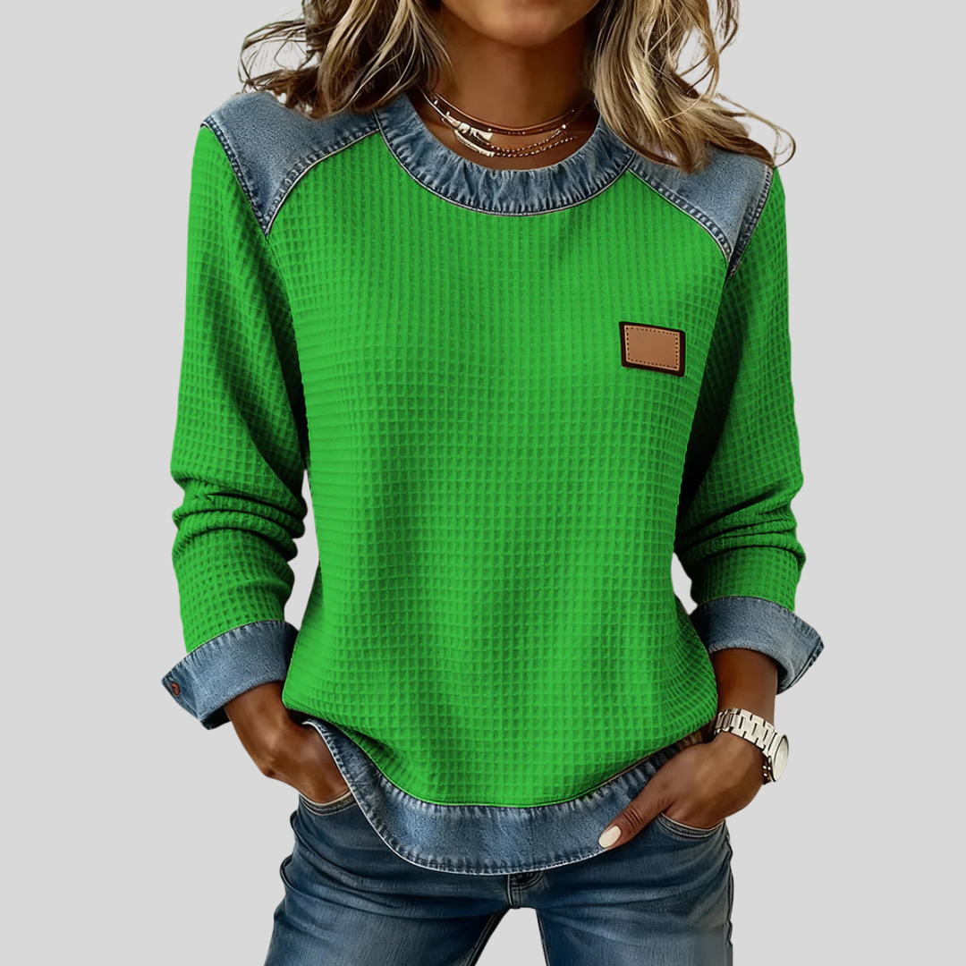Waffle-knit sweatshirt with denim-inspired trim and a small chest patch, shown in several colours