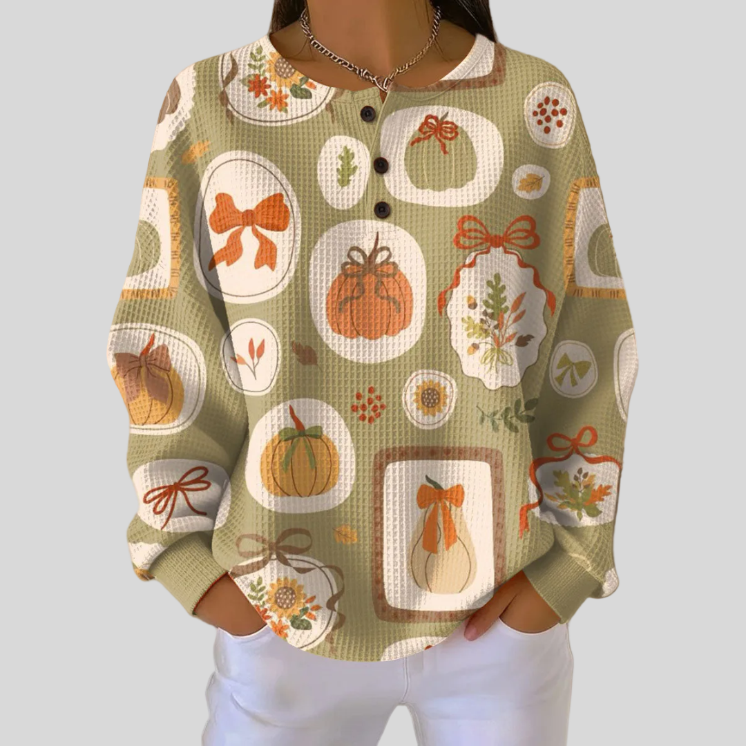 Waffle knit henley sweatshirt with all-over pumpkin and bow print and button neckline