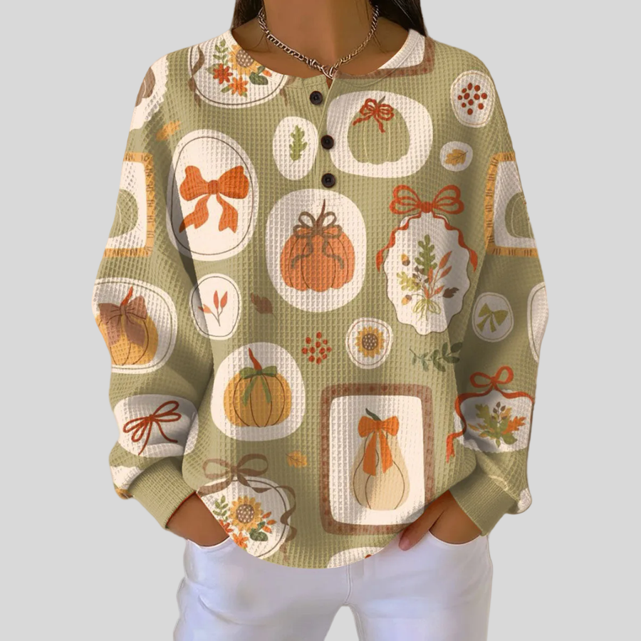 Waffle knit henley sweatshirt with all-over pumpkin and bow print and button neckline