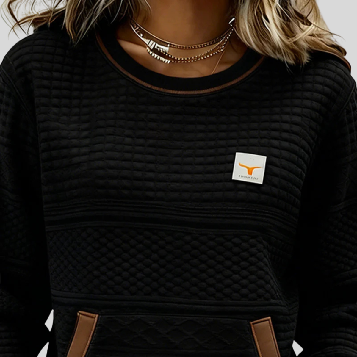 Women's crew neck colorblock sweatshirt with quilted texture panels and front kangaroo pocket