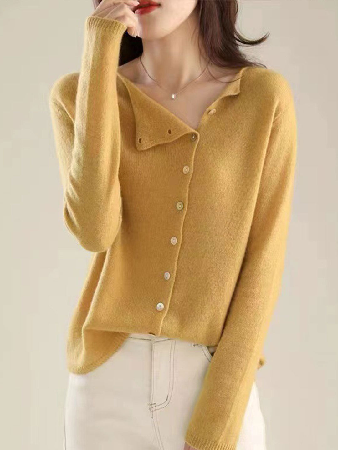 Women's V-neck button-front long sleeve cardigan with softly shaped collar and hip-length hem