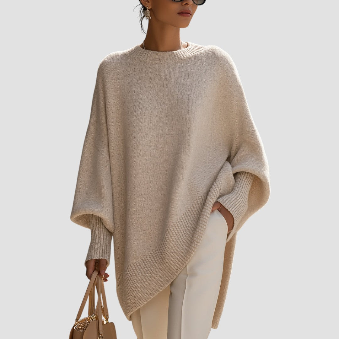 Oversized poncho-style sweater with round neckline, ribbed cuffs and hem in a neutral tone