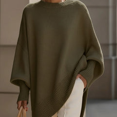 Oversized poncho-style sweater with round neckline, ribbed cuffs and hem in a neutral tone