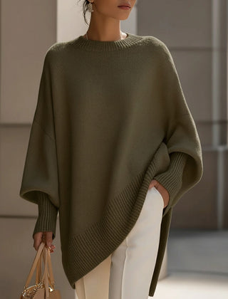 Oversized poncho-style sweater with round neckline, ribbed cuffs and hem in a neutral tone