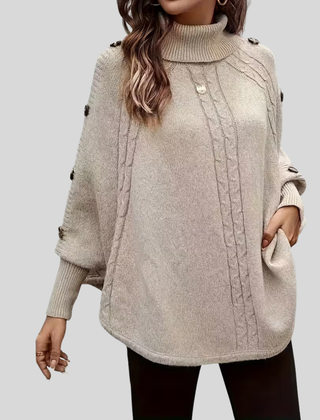 High-neck cable-knit sweater with ribbed turtleneck, shoulder buttons and relaxed oversized fit