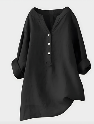 Woman wearing a relaxed cotton-linen V-neck blouse with soft draping