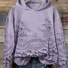 Women's floral eyelet pullover hoodie with structured hood and scalloped hem