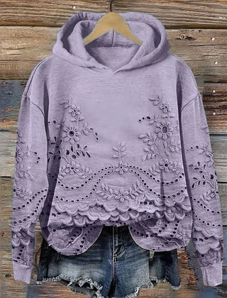 Women's floral eyelet pullover hoodie with structured hood and scalloped hem