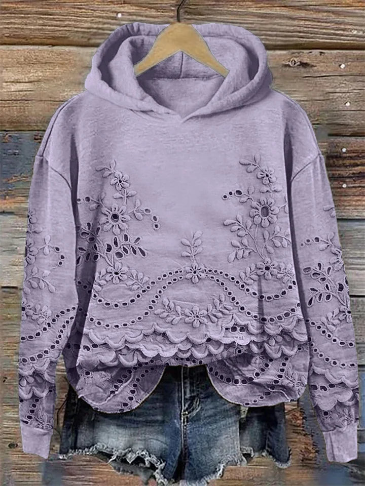 Women's floral eyelet pullover hoodie with structured hood and scalloped hem