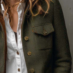 Olive herringbone blazer with contrast collar and cuff trim and structured tailored silhouette