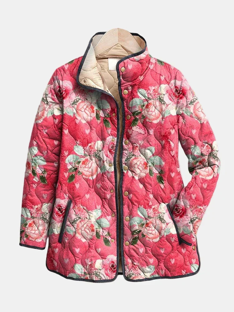 Pink floral print quilted jacket with a soft relaxed fit, shown from the front