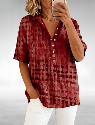 Woman wearing an elegant relaxed lightweight blouse with a soft, flowing drape