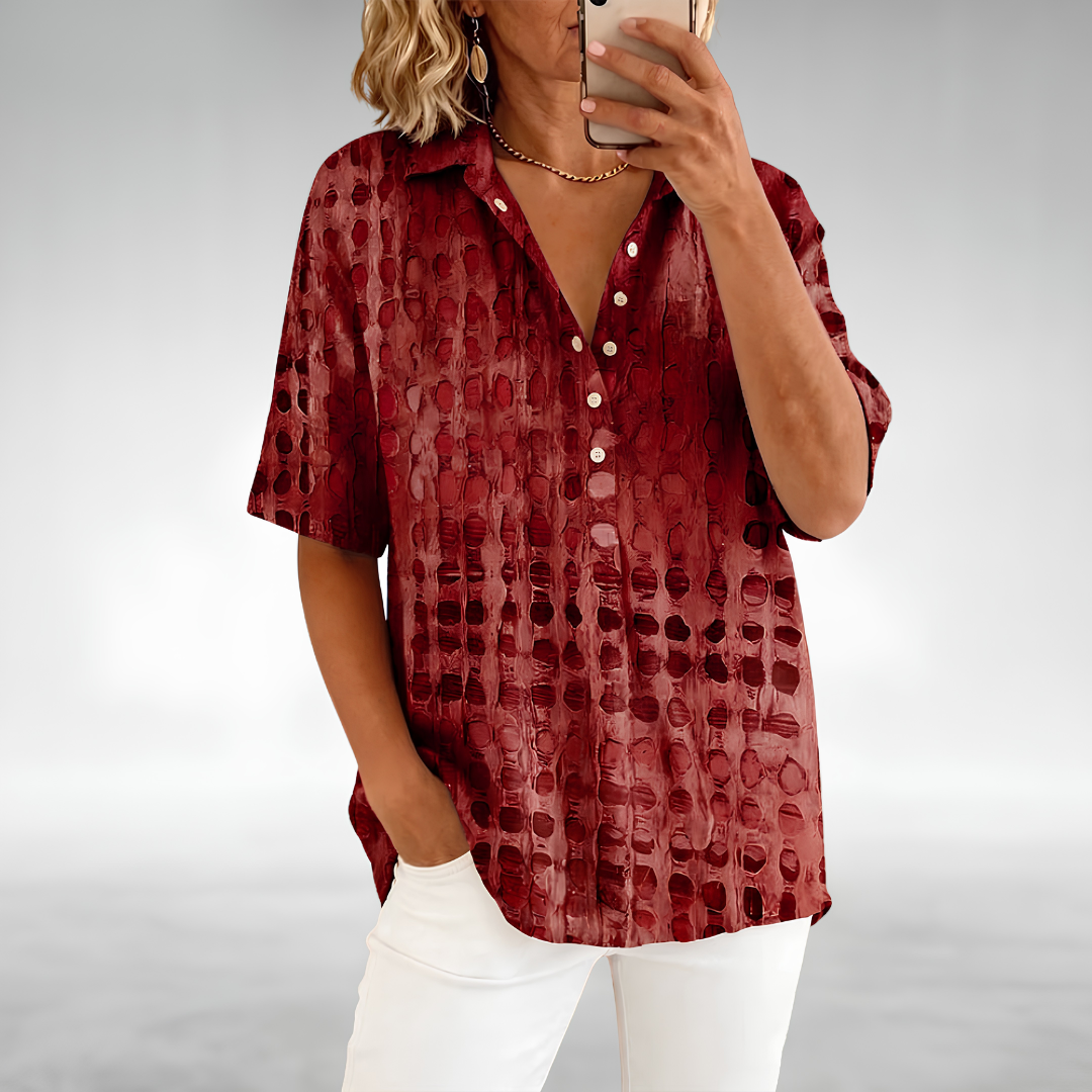 Woman wearing an elegant relaxed lightweight blouse with a soft, flowing drape