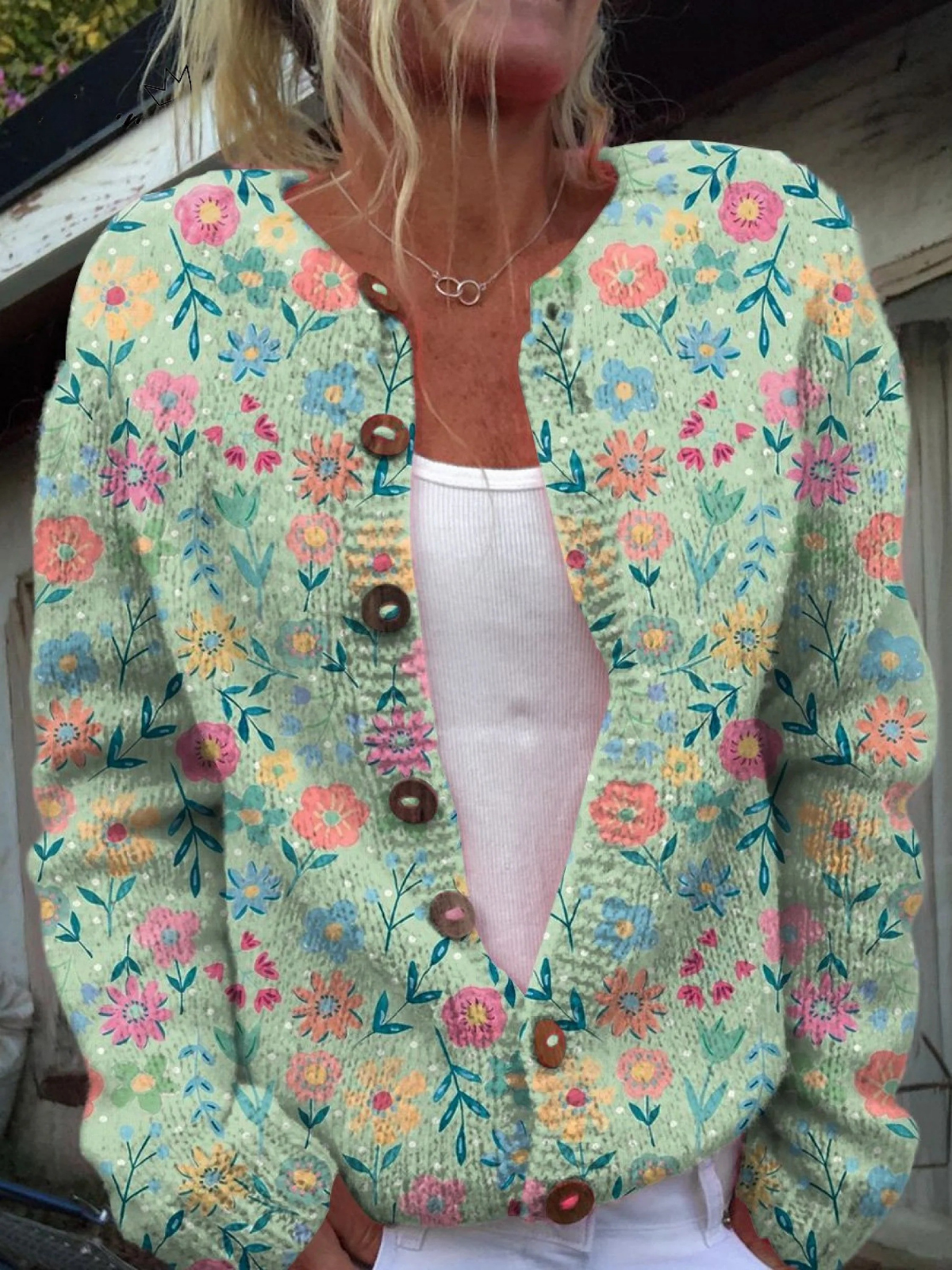 Women's open-front vintage floral cardigan in soft pastel print with toggle buttons