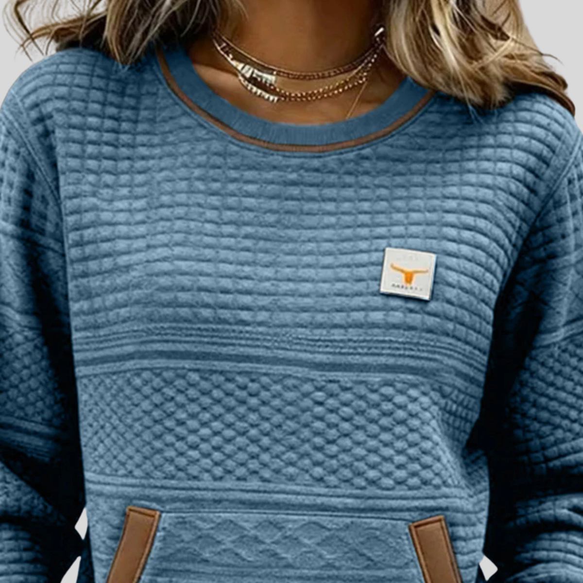 Women's crew neck colorblock sweatshirt with quilted texture panels and front kangaroo pocket