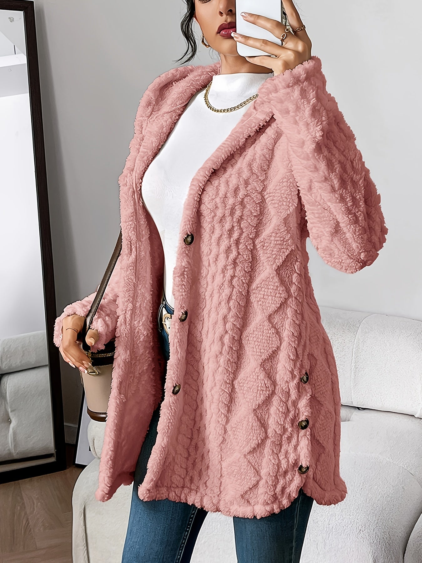 Women's hooded longline cardigan with button-front closure and raised textured surface
