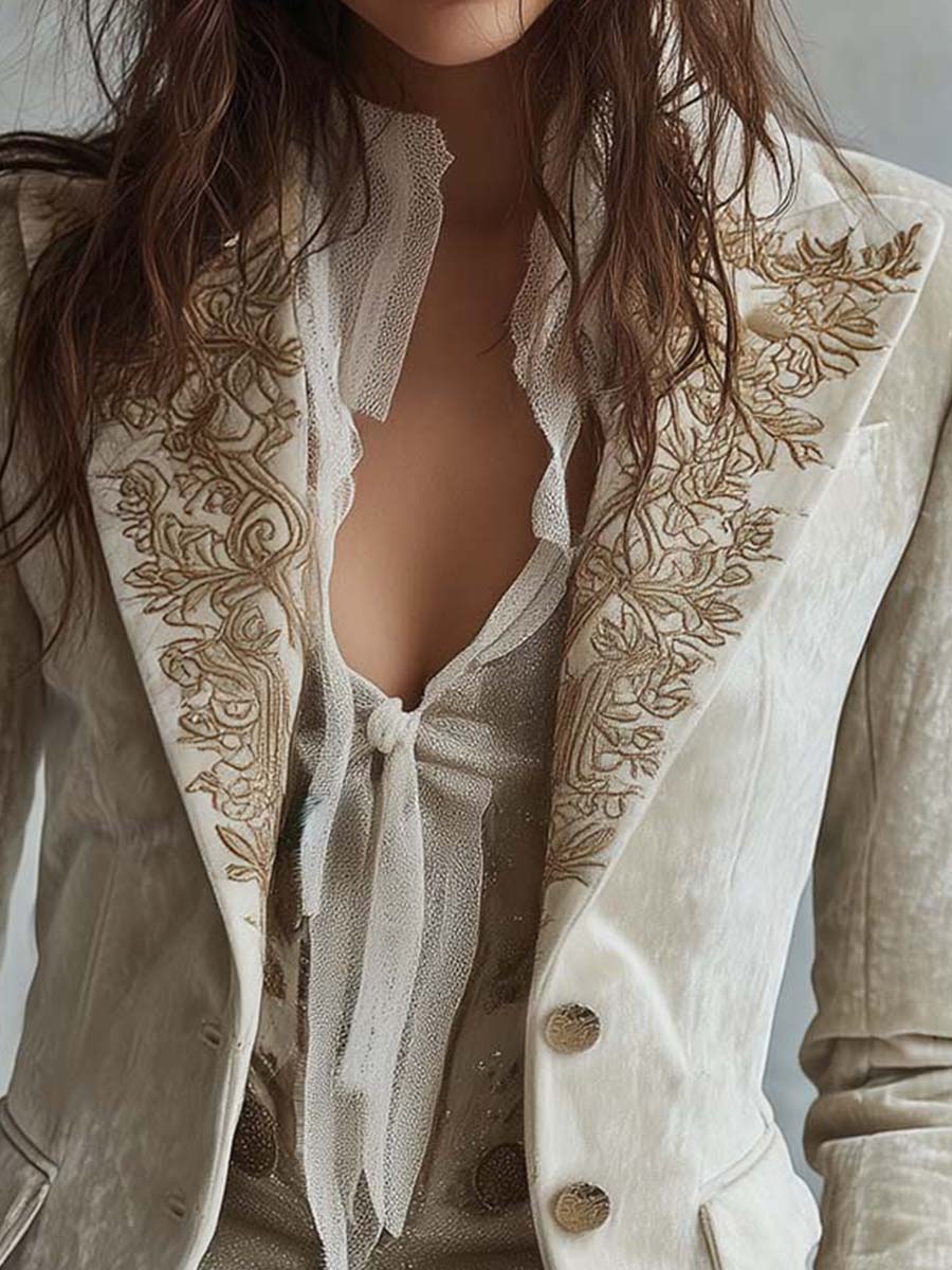 Ivory tailored blazer with gold-toned floral embroidery on the lapels and cuffs