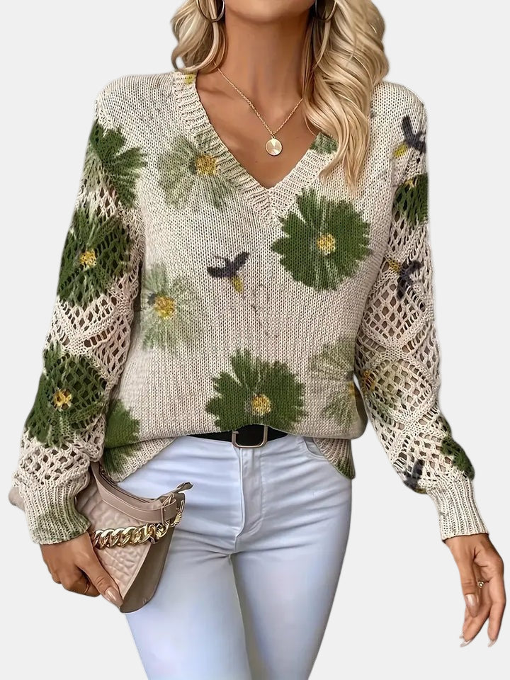 Women's floral knit V-neck sweater with open-knit sleeves and ribbed cuffs and hem