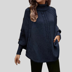 High-neck cable-knit sweater with ribbed turtleneck, shoulder buttons and relaxed oversized fit