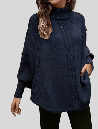 High-neck cable-knit sweater with ribbed turtleneck, shoulder buttons and relaxed oversized fit