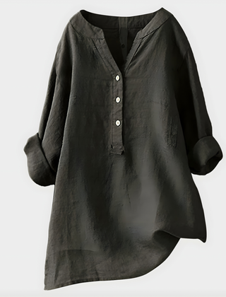 Woman wearing a relaxed cotton-linen V-neck blouse with soft draping
