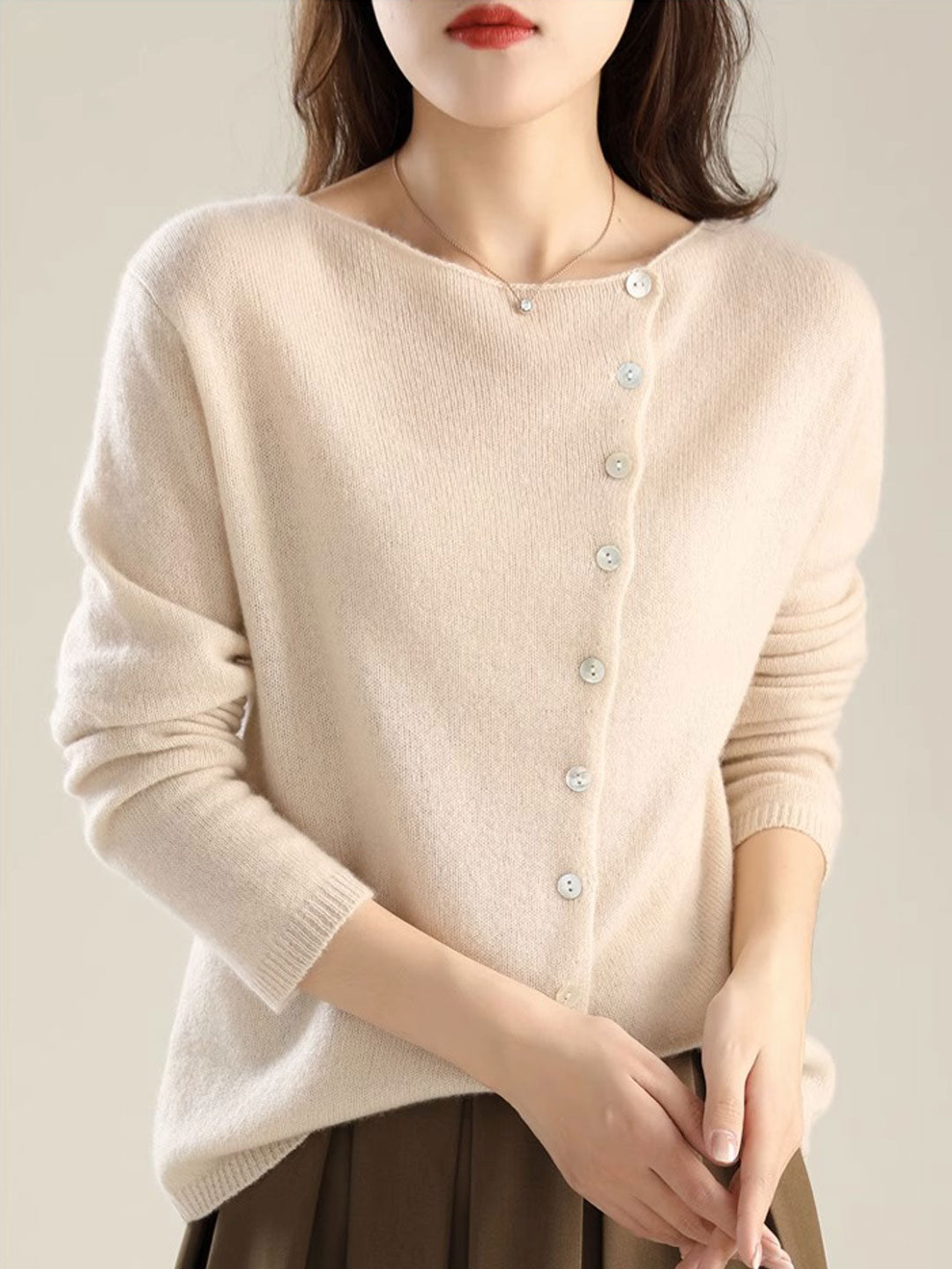 Women's V-neck button-front long sleeve cardigan with softly shaped collar and hip-length hem