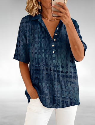 Woman wearing an elegant relaxed lightweight blouse with a soft, flowing drape