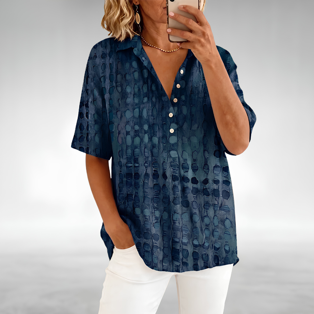 Woman wearing an elegant relaxed lightweight blouse with a soft, flowing drape