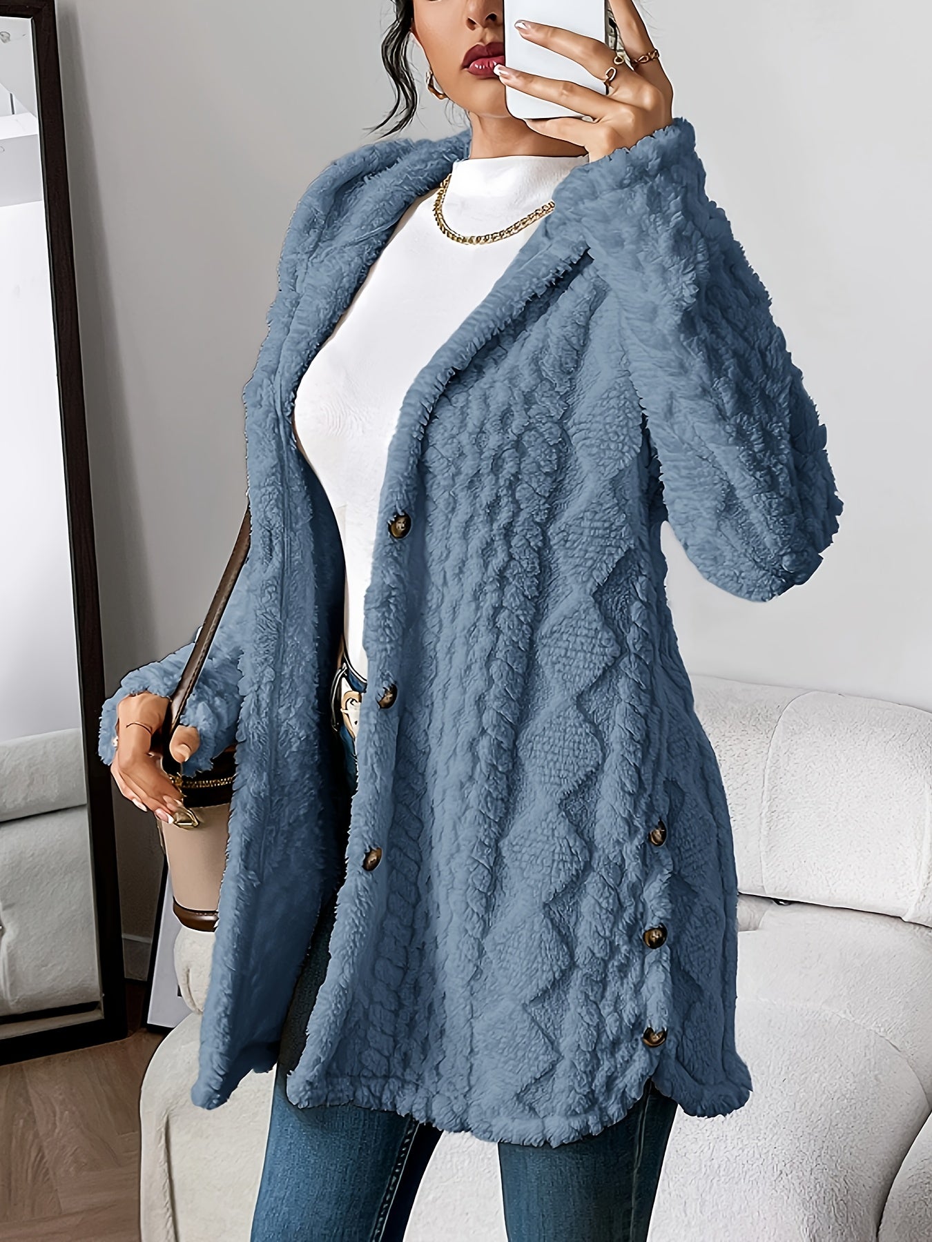 Women's hooded longline cardigan with button-front closure and raised textured surface