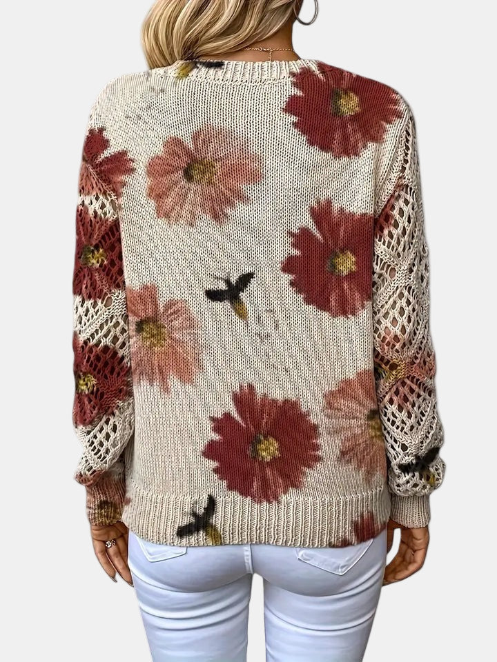 Women's floral knit V-neck sweater with open-knit sleeves and ribbed cuffs and hem