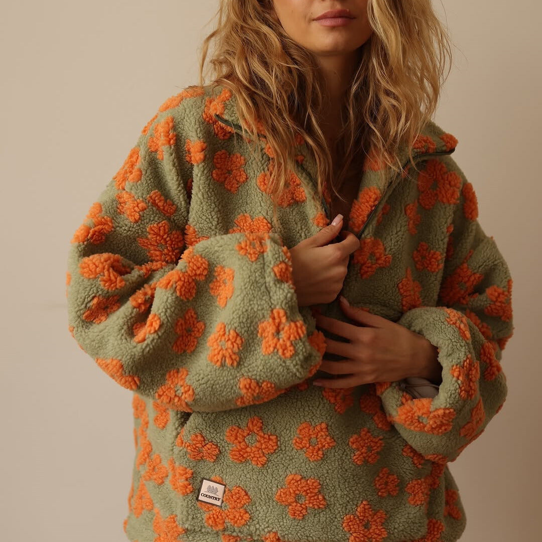 Women's floral quarter-zip sweater with stand collar and gathered cuffs in a relaxed fit