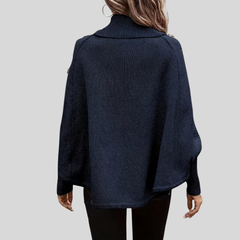 High-neck cable-knit sweater with ribbed turtleneck, shoulder buttons and relaxed oversized fit