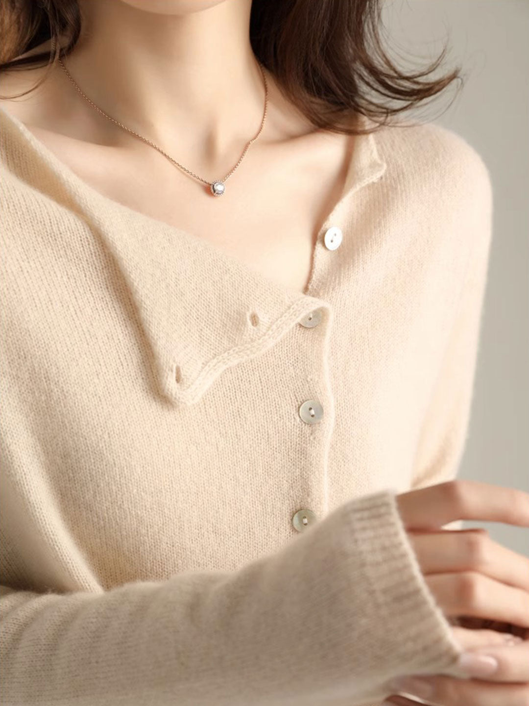 Women's V-neck button-front long sleeve cardigan with softly shaped collar and hip-length hem