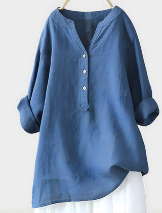 Woman wearing a relaxed cotton-linen V-neck blouse with soft draping
