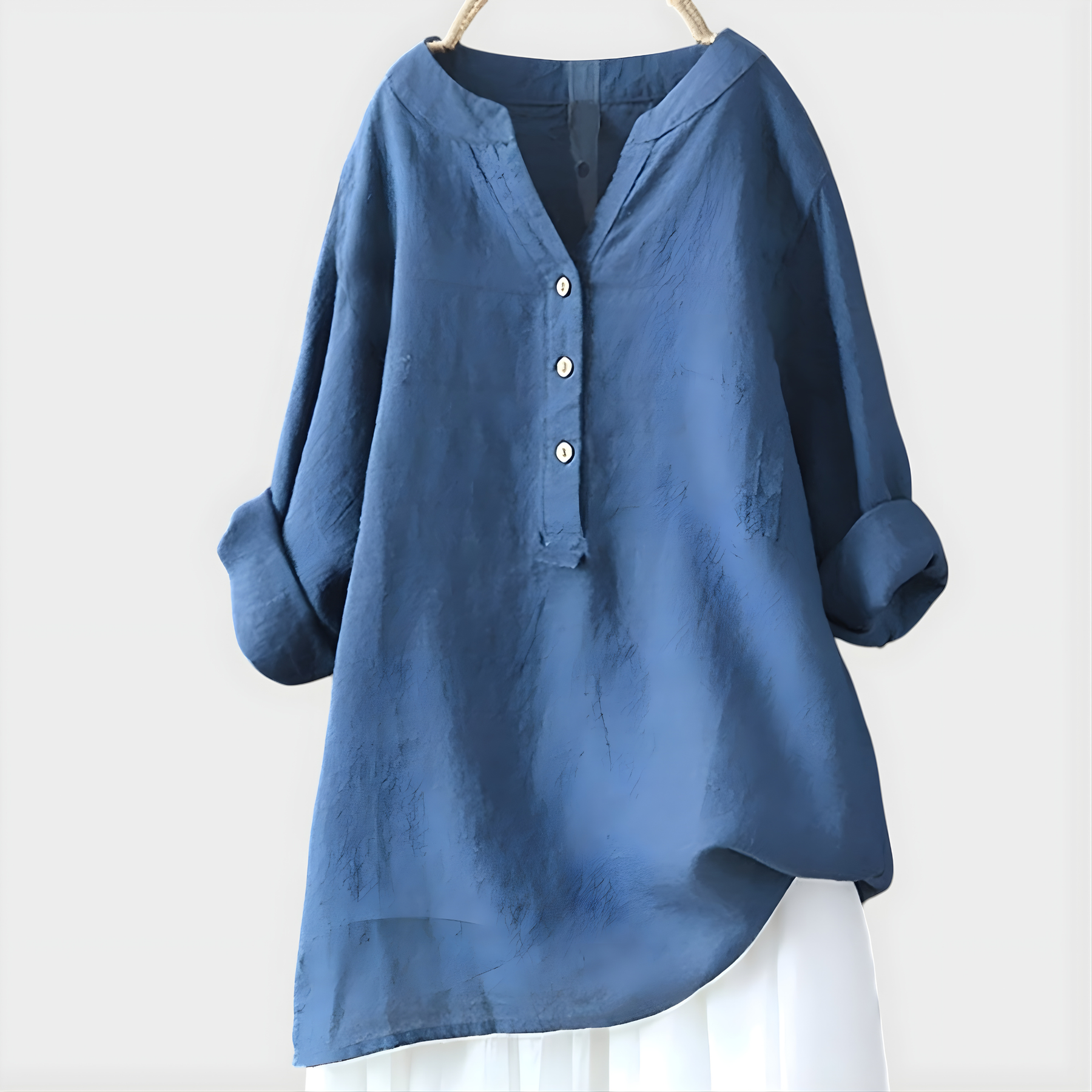 Woman wearing a relaxed cotton-linen V-neck blouse with soft draping