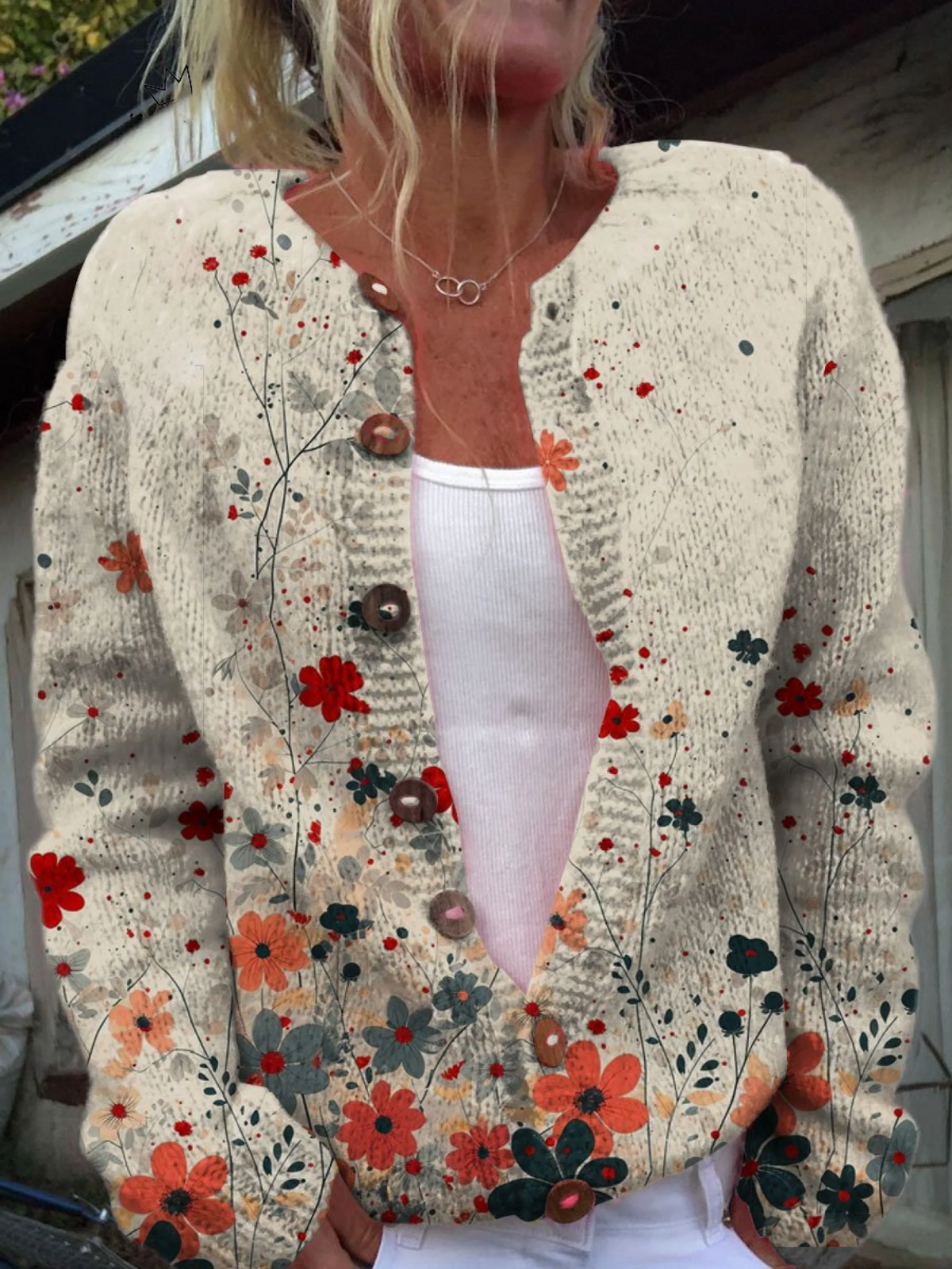 Women's vintage floral knit cardigan with open front and button closures in warm reds, coral and sage