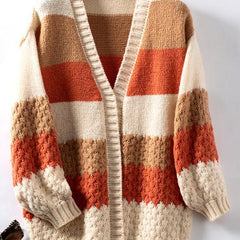 Woman wearing an oversized slouchy open-front knit cardigan with long sleeves