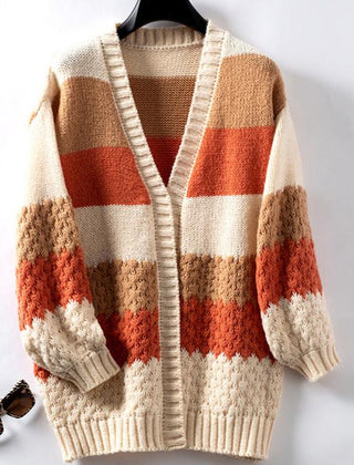Woman wearing an oversized slouchy open-front knit cardigan with long sleeves